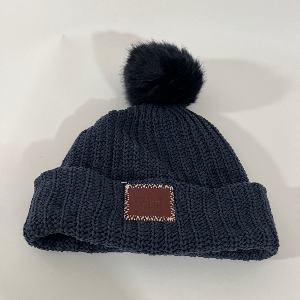 Love Your Melon Cuffed Beanie Hat in Navy Blue with Navy Blue Pom Brown Patch